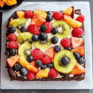 This Brownie Fruit Pizza is a delicious twist on traditional pizza! With a rich brownie crust, creamy frosting, and a colorful array of fresh fruits on top, it's perfect for parties and gatherings. Kids and adults alike will love this fun treat. Save this recipe to impress your guests at your next celebration or family get-together!