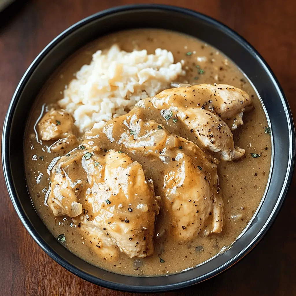 Tender chicken slow-cooked in a rich, flavorful gravy makes for a comforting meal that everyone will love. This simple recipe uses everyday ingredients and takes little prep time. Perfect for busy weeknights or family gatherings! Save this Slow Cooker Chicken and Gravy recipe for the next time you're looking for an easy and delicious dinner idea.