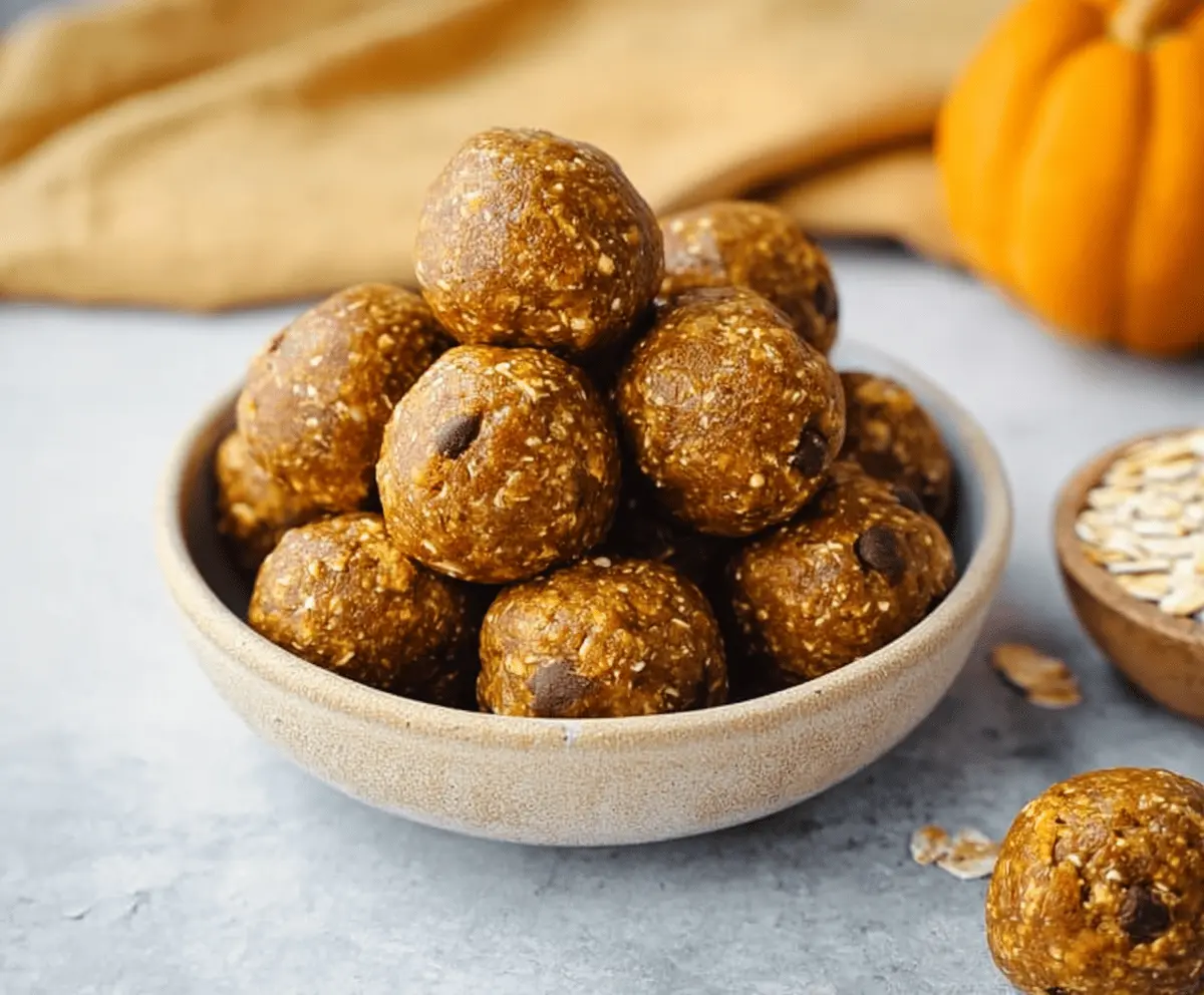 Healthy pumpkin pie protein balls with cinnamon and oats, perfect for a nutritious snack or dessert.
