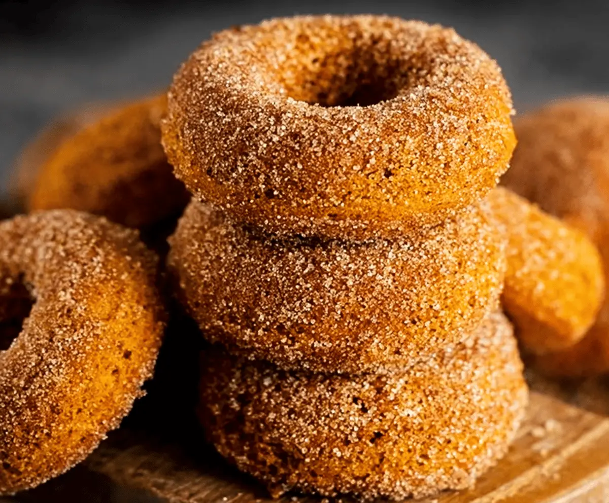 Delicious homemade pumpkin baked donuts topped with cinnamon sugar, perfect for fall treats and seasonal baking