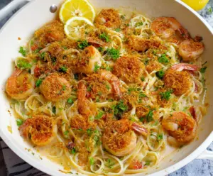 Delicious Shrimp Scampi Linguine served in a fancy dish, featuring golden-brown shrimp and garlic-infused pasta.