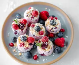 Delicious frozen Greek yogurt bites with fresh berries in a bowl, perfect healthy snack.