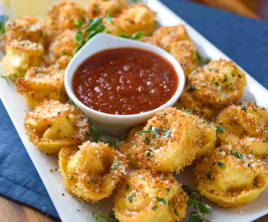 Golden Parmesan crusted tortellini bites served with fresh herbs and marinara dipping sauce.