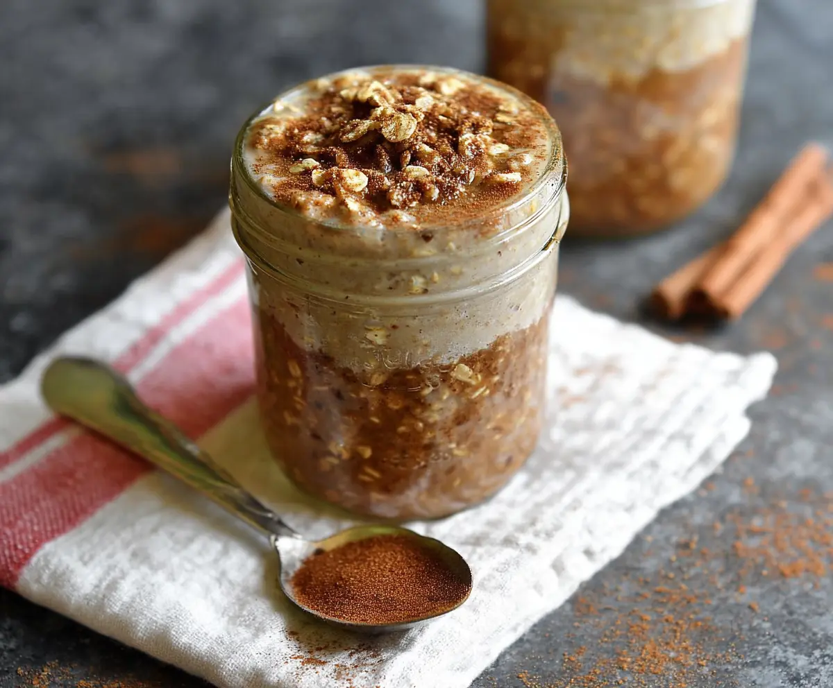 Delicious Snickerdoodle Overnight Oats in a glass jar topped with cinnamon and sugar