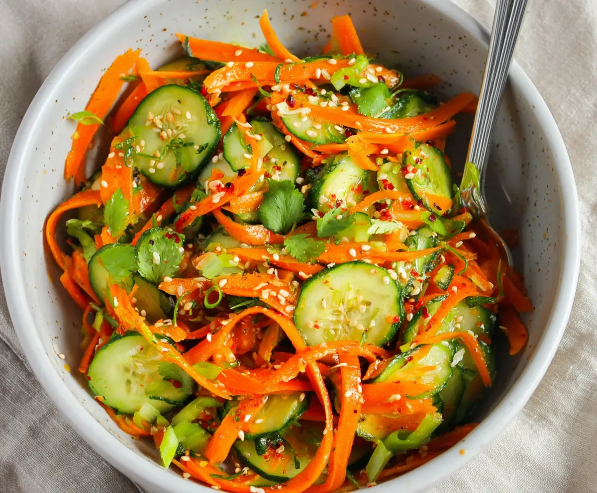 Fresh Asian carrot and cucumber salad with vibrant colors, perfect for a healthy meal or side dish.