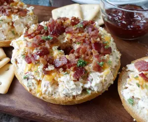 Delicious Bacon Cheese Ring Party Dip with crispy bacon and melted cheese served as an appetizer.