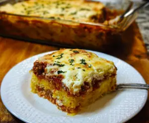 Delicious baked spaghetti squash lasagna layered with cheese and tomato sauce.