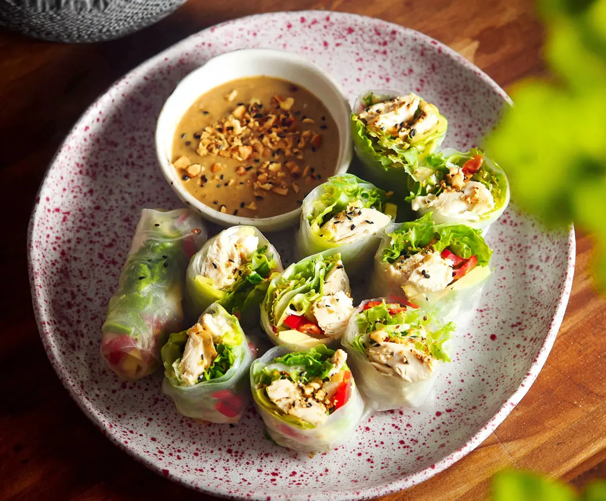 Delicious Caesar Chicken Rice Paper Rolls with fresh vegetables and creamy dressing