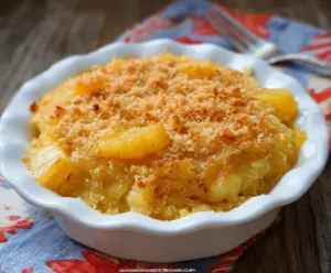 Delicious Sweet And Sour Pineapple Casserole served in a baking dish with vibrant pineapple chunks and a savory glaze.
