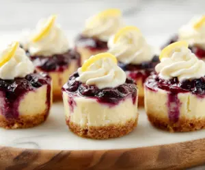 Delicious Lemon Blueberry Cheesecake Bites with fresh blueberries and lemon zest on a white plate